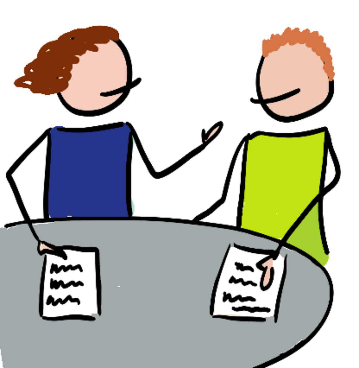 Frau und Mann sitzen am Tisch und besprechen sich